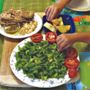 plate with chopped veggies and pita