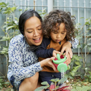 Mom and child learning how to garden