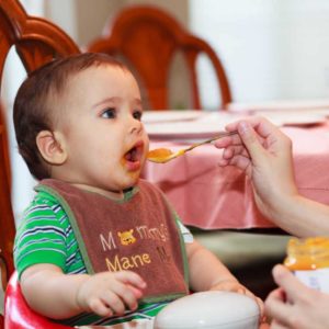 baby eating meal with spices