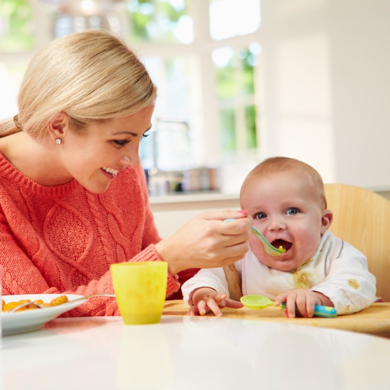 mom feeding baby with quinoa for babies - SuperKidsNutrition.com