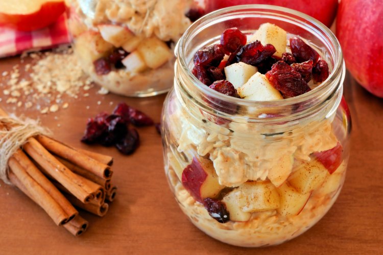 Autumn overnight oats with apples and cranberries in a mason jar