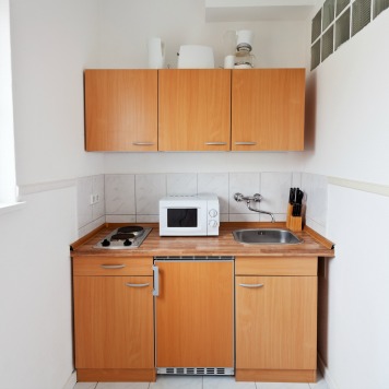 Small Kitchen With Furniture Set And Kitchen Equipment