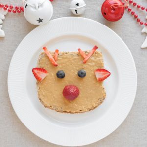 Christmas reindeer on peanut butter toast breakfast, fun food healthy holiday art for kids