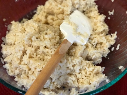 brown rice in a bowl with a spatula