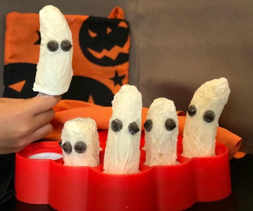 Halloween themed greek yogurt banana popsicles with chocolate chip eyes