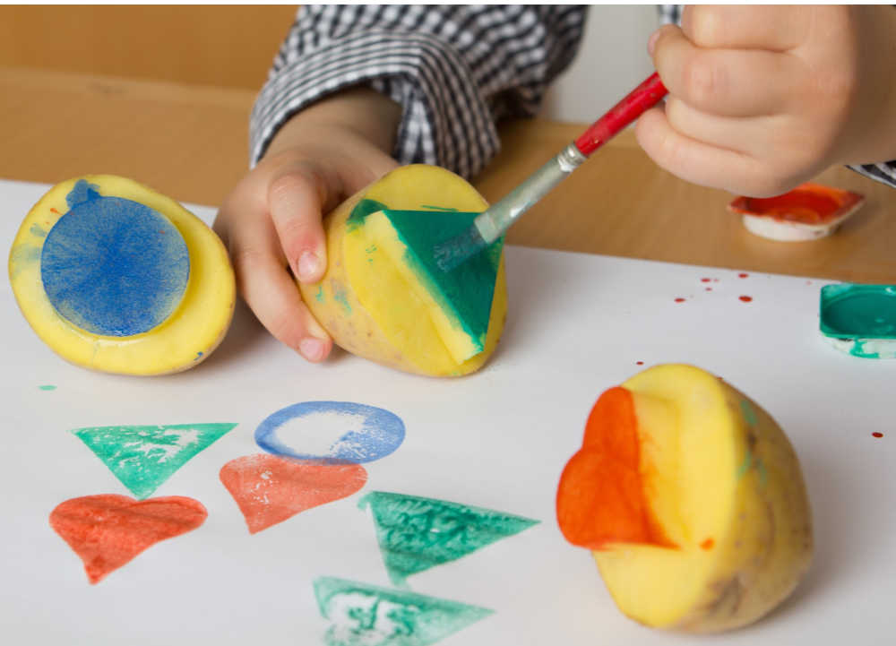 holiday activity homemade wrapping paper with potato stamper