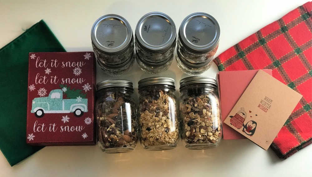 holiday granola in jars with decorations for healthy holiday dessert