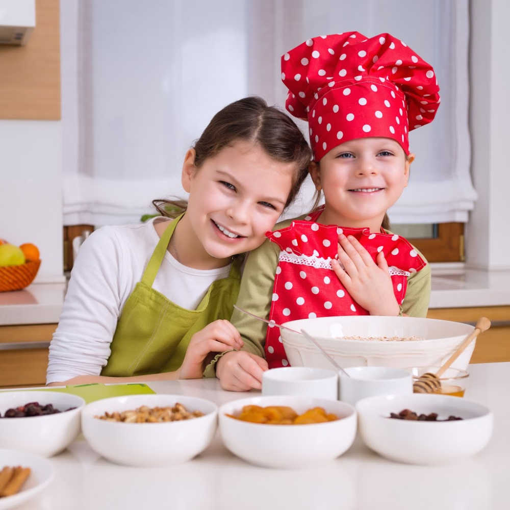 kids making trail mix at a trail mix station