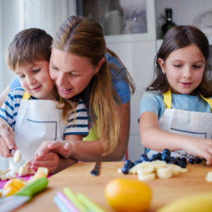 daughter and son cooking with mom fruits