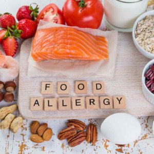 Food allergies - food concept with major allergens, rustic wood background