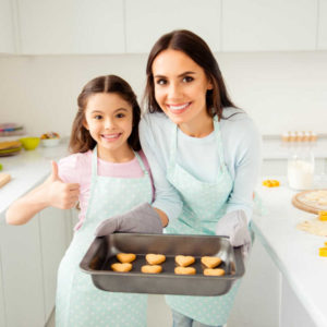 mom and daughter baking healthy for valentines day