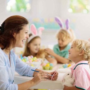 mom and son doing easter basket decorations