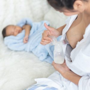 mom pumping breastmilk for baby