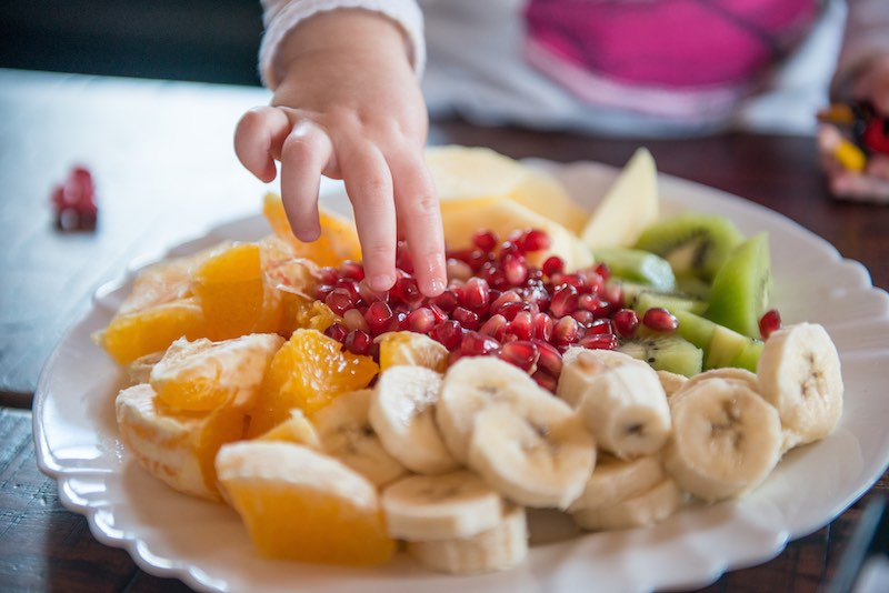 Fruit pile for kid with pomegranate — Health, Kids