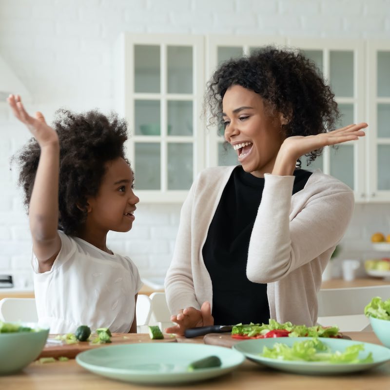 mom and daughter high fiving prevent colon cancer — Health, Kids