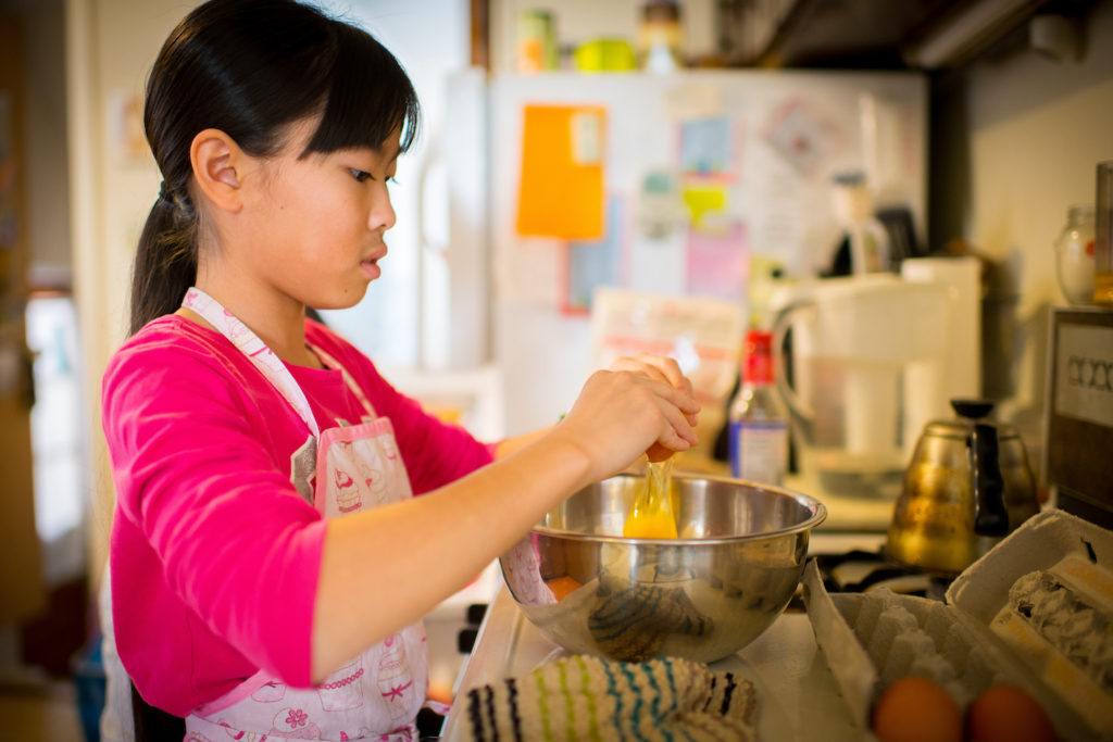 Girl making eggs